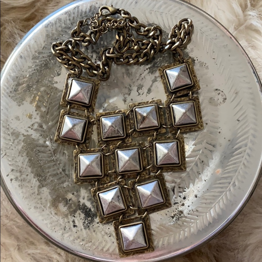 Silver studded necklace.